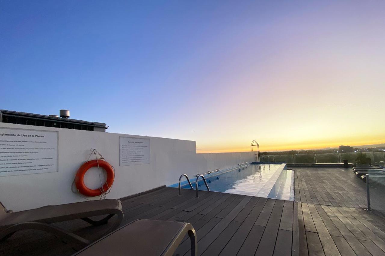Wyndham Concepcion Pettra Hotel Exterior photo Rooftop pool at the hotel